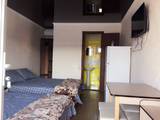1-комнатный четырехместный Люкс гостевой дом Альпина кровати