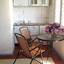 Стол со стульями в номере коттедж Родос в Кирилловке