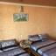 Кровати в номере гостевого дома Акватаун в Кирилловке