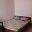 Двуспальная кровать в номере база Чаривная 29 в Кириловке