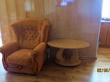 кресло в номере гостевой дом Адажио в Кирилловке
