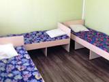 односпальные кровати в номере эконом база отдыха Рыбацкий стан в Кирилловке