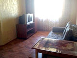 Телевизор в номере гостевой дом Уютный дворик в Кирилловке